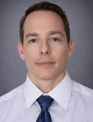 Professional portrait of Ryan Smart, MD, DMD, featured Conzultos expert