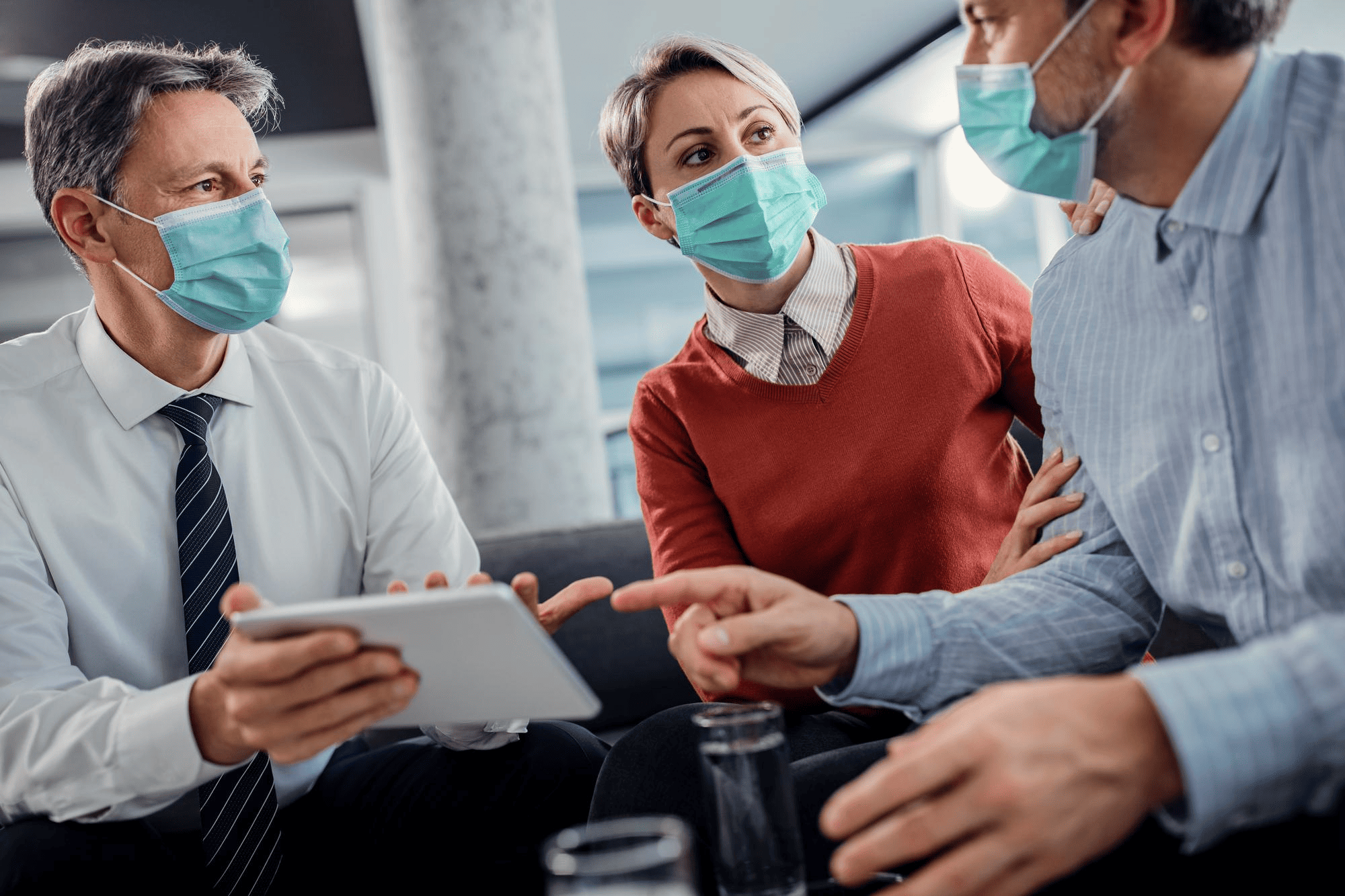 Healthcare professional in scrubs and a protective face mask in a hospital setting